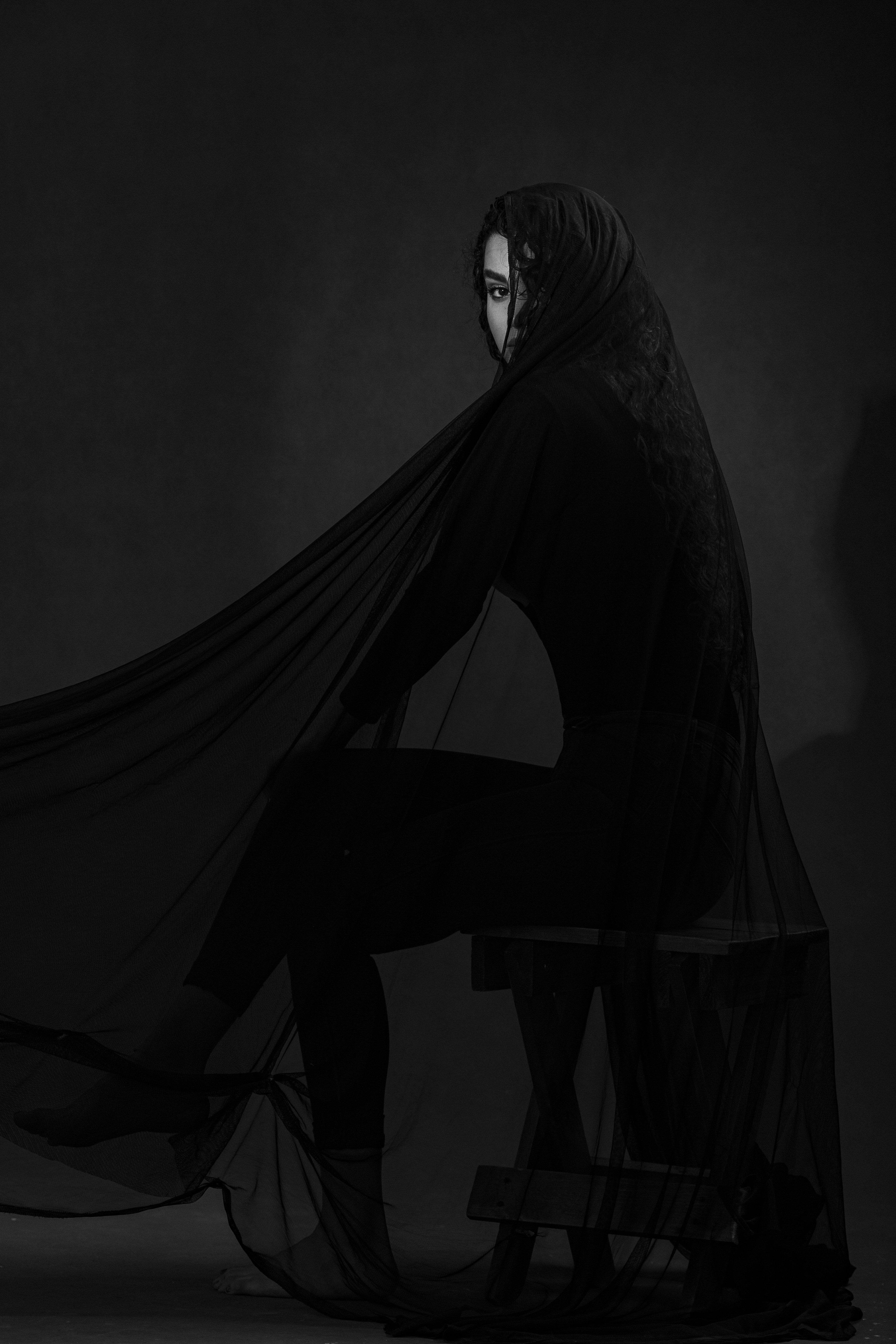 Kumoi lookbook model in a sculptural black silhouette